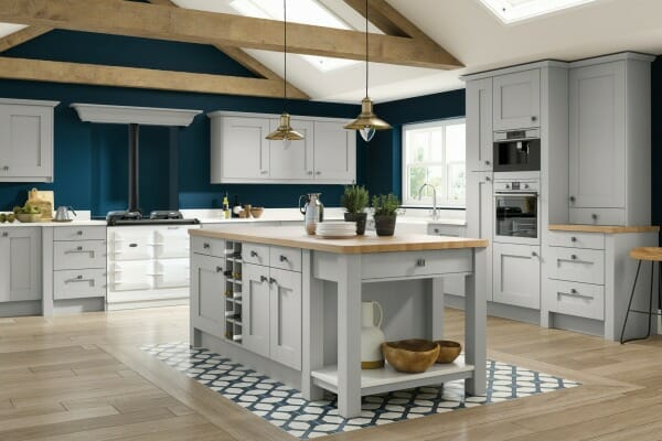 A traditional kitchen with wood cabinetry, a central island, and classic fixtures, evoking timeless elegance and warmth.