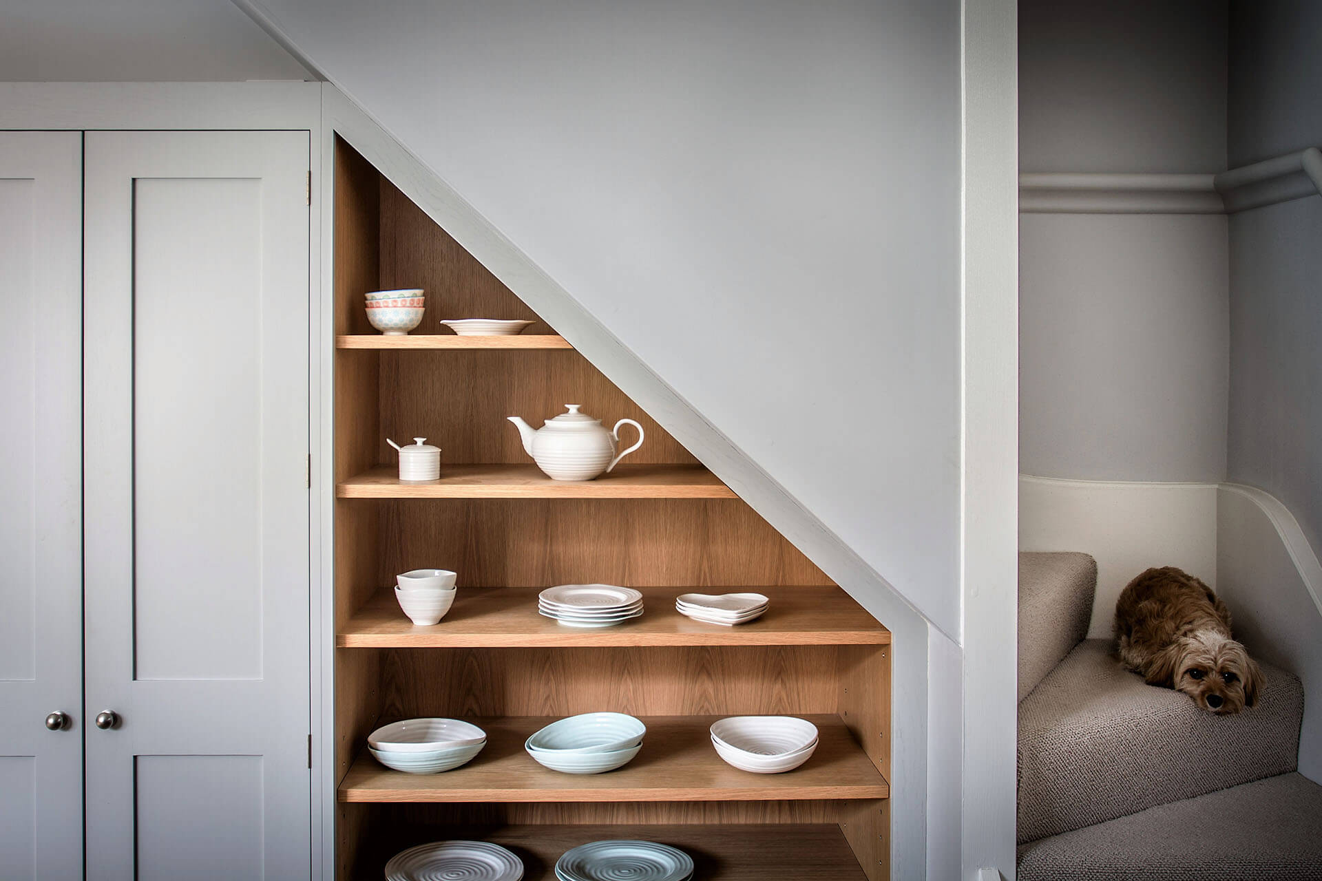 Shaker-Kitchen-with-built-in-angled-understair-shelving-cabinet angled units