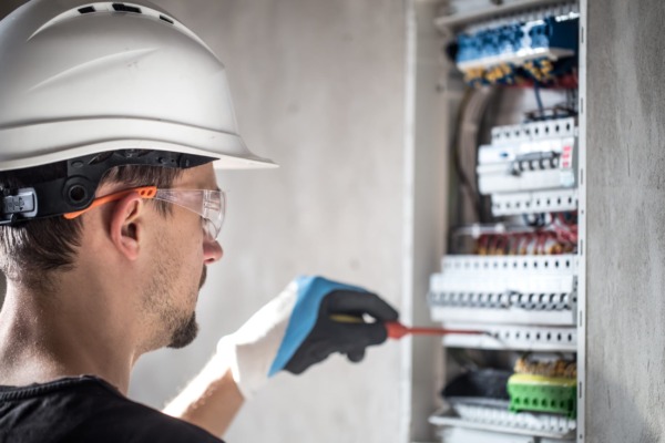 Qualified electrician installing a new kitchen fuse box during Mastercraft electrical works